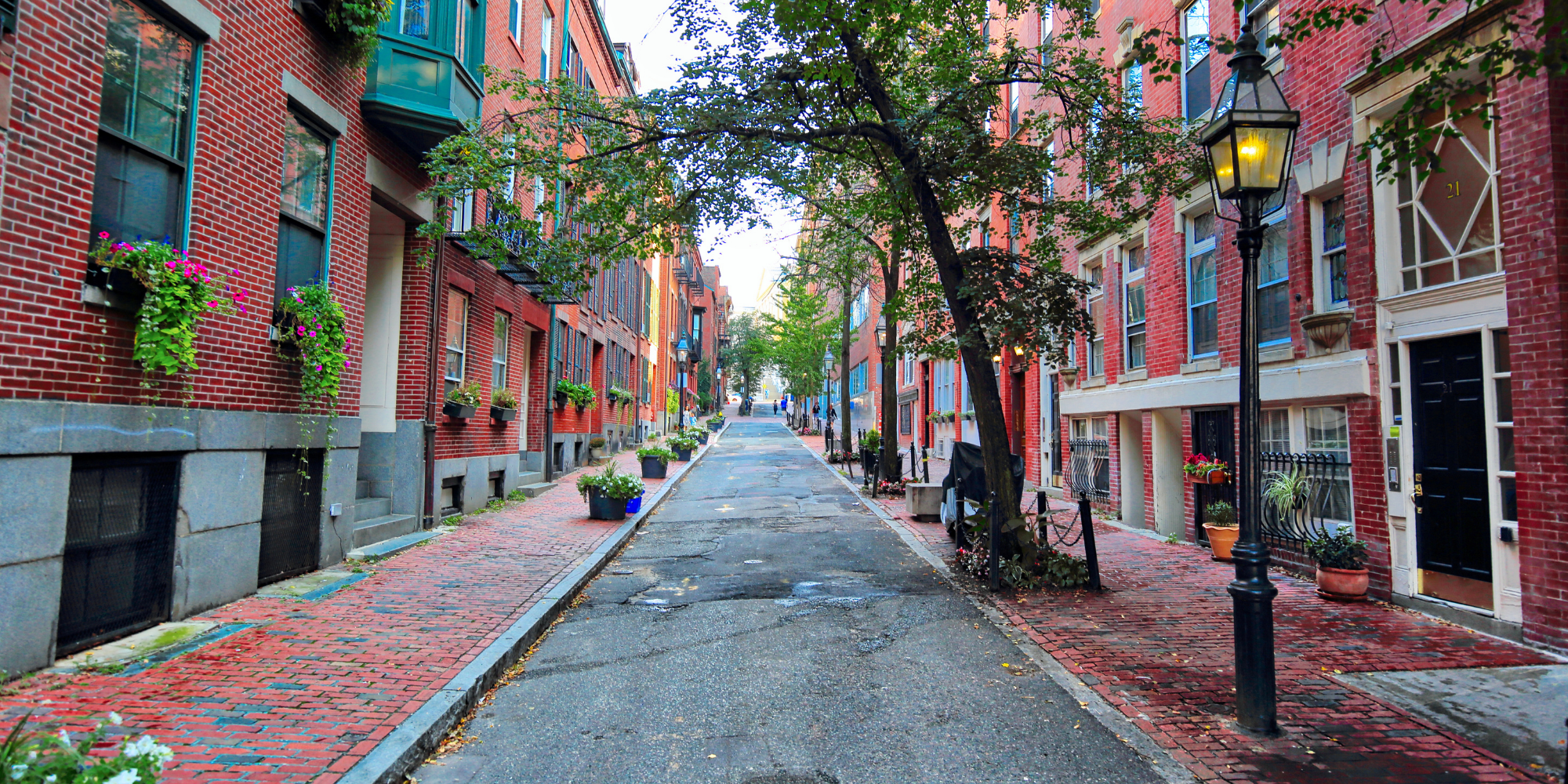 Boston Beacon Hill apartment rental costs 2025 — downtown one-bedroom averaging $3,100 and two-bedrooms over $4,000, compared to emerging neighborhoods like Allston and Jamaica Plain with lower rents